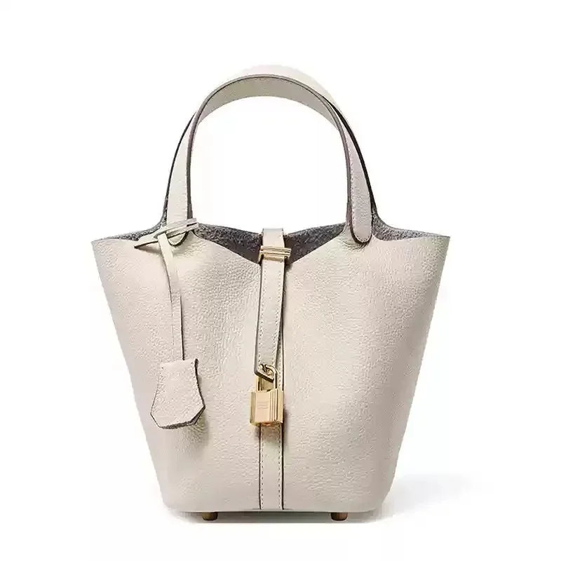 Women’s Leather Bucket Handbag A soft, stylish summer essential featuring a modern basket design with a convenient mobile phone pocket.