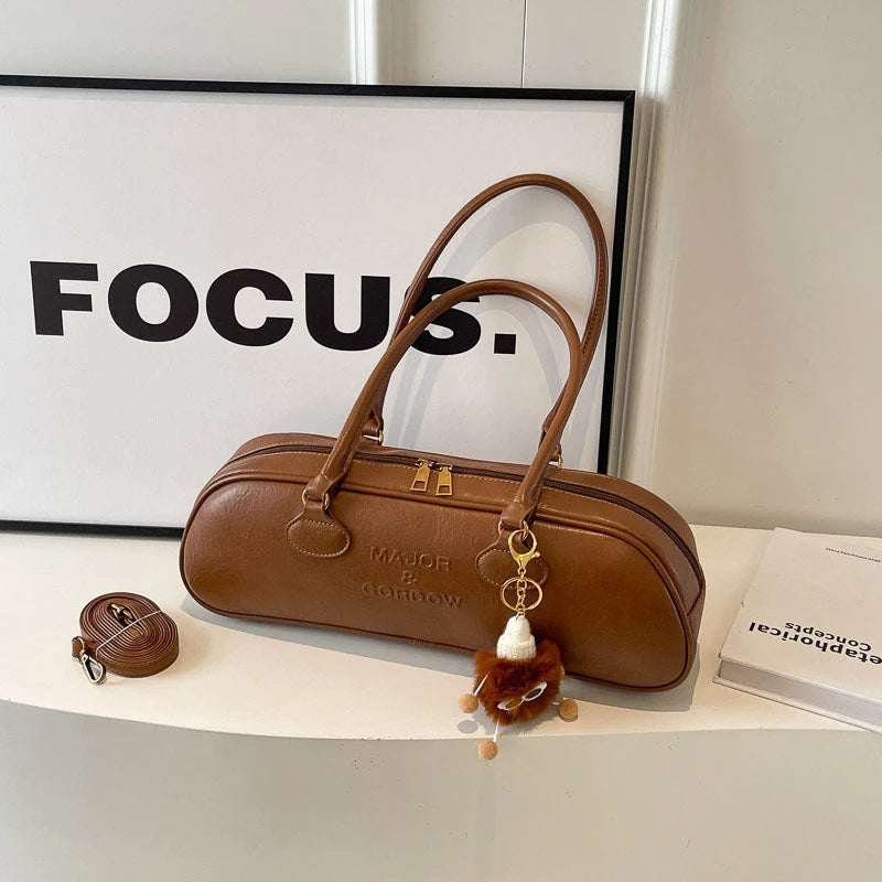 Stitched Pillow-Shape Shoulder Bag 
Trendy zippered handbag with a soft, structured design. Versatile for shoulder or hand carry perfect for everyday style.