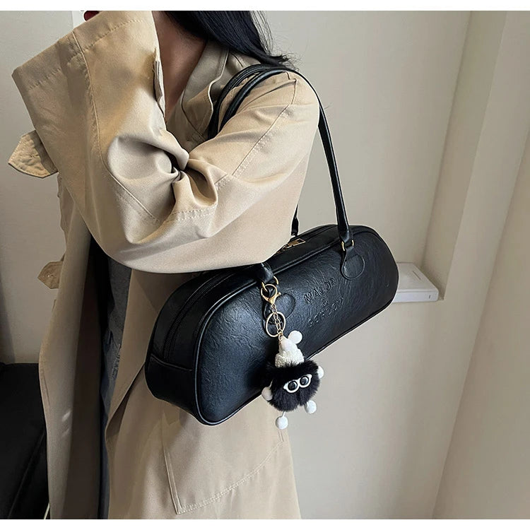 Stitched Pillow-Shape Shoulder Bag 
Trendy zippered handbag with a soft, structured design. Versatile for shoulder or hand carry perfect for everyday style.