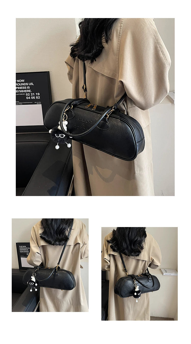 Stitched Pillow-Shape Shoulder Bag 
Trendy zippered handbag with a soft, structured design. Versatile for shoulder or hand carry perfect for everyday style.