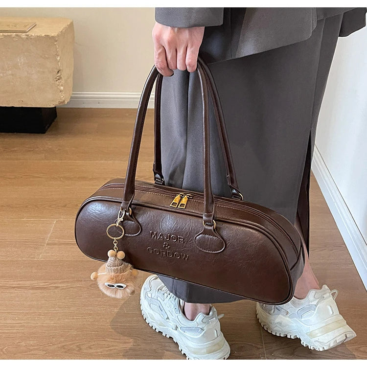 Stitched Pillow-Shape Shoulder Bag 
Trendy zippered handbag with a soft, structured design. Versatile for shoulder or hand carry perfect for everyday style.