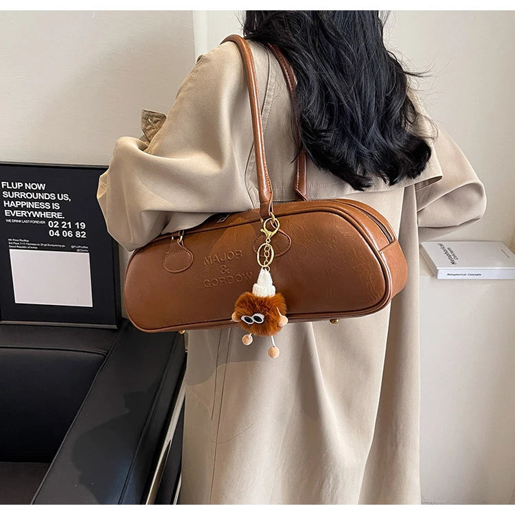 Stitched Pillow-Shape Shoulder Bag 
Trendy zippered handbag with a soft, structured design. Versatile for shoulder or hand carry perfect for everyday style.
