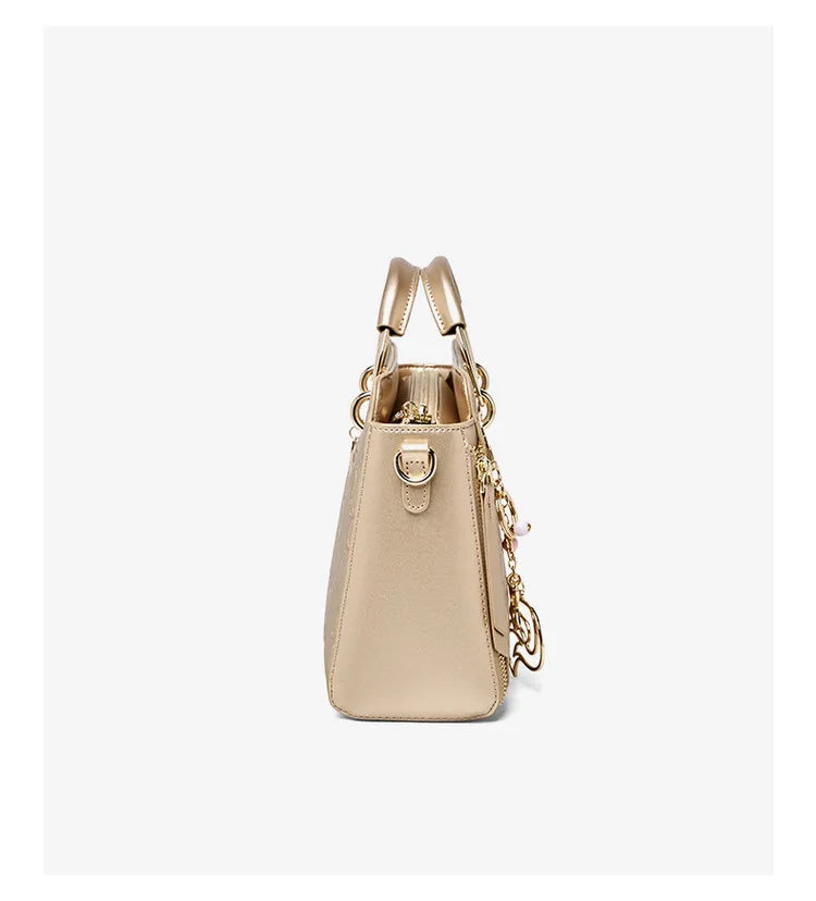 Cowhide Leather Women’s Handbag Luxury Design Elegant shoulder, crossbody, and tote style in one. Spacious and stylish, perfect for moms and everyday use.