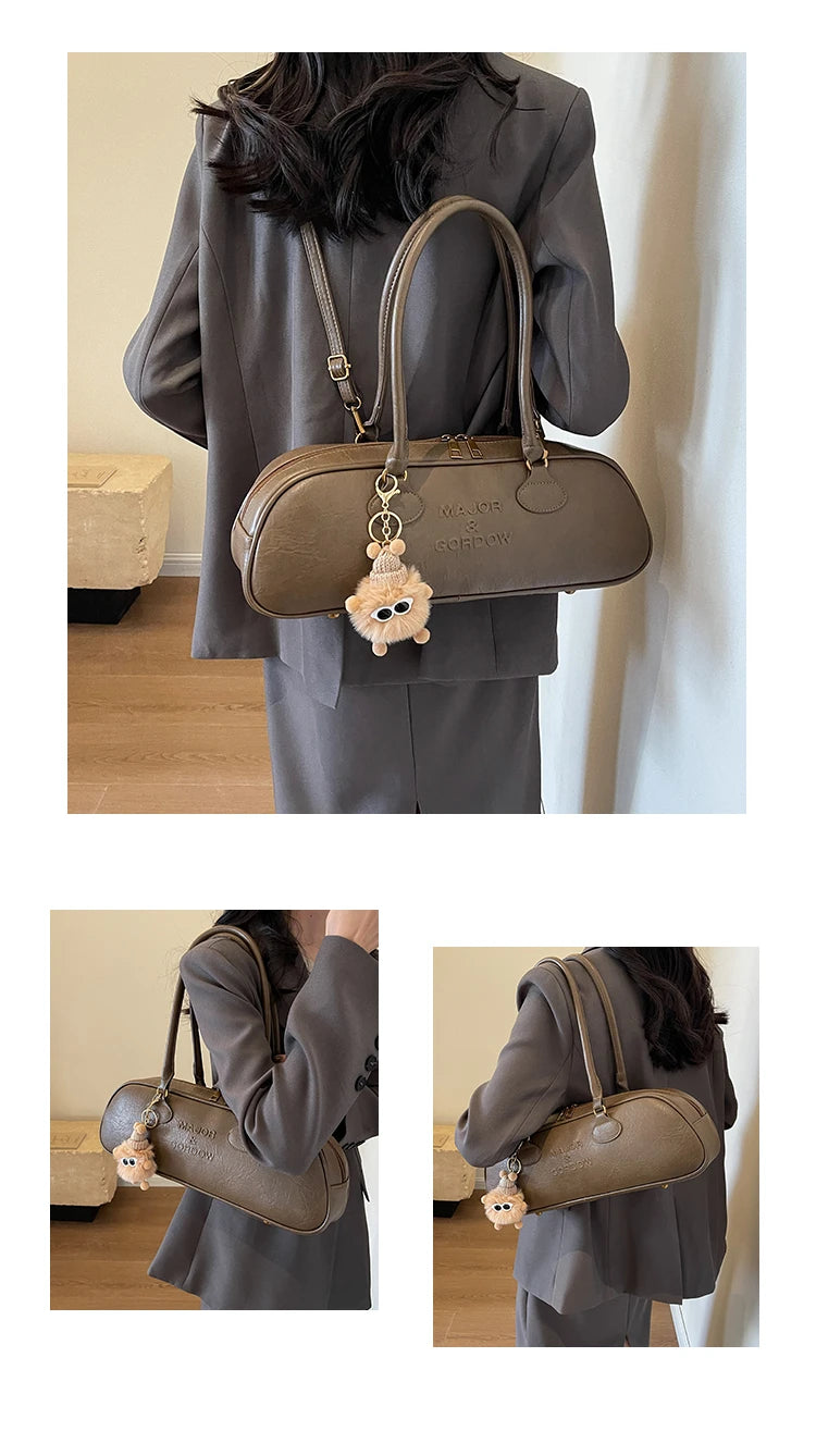 Stitched Pillow-Shape Shoulder Bag 
Trendy zippered handbag with a soft, structured design. Versatile for shoulder or hand carry perfect for everyday style.