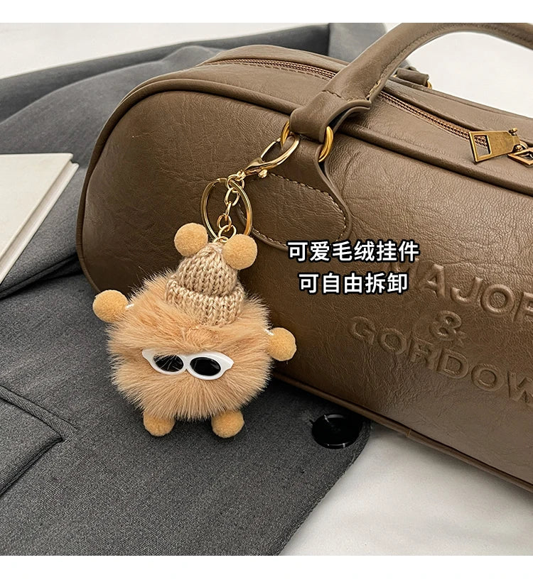 Stitched Pillow-Shape Shoulder Bag 
Trendy zippered handbag with a soft, structured design. Versatile for shoulder or hand carry perfect for everyday style.