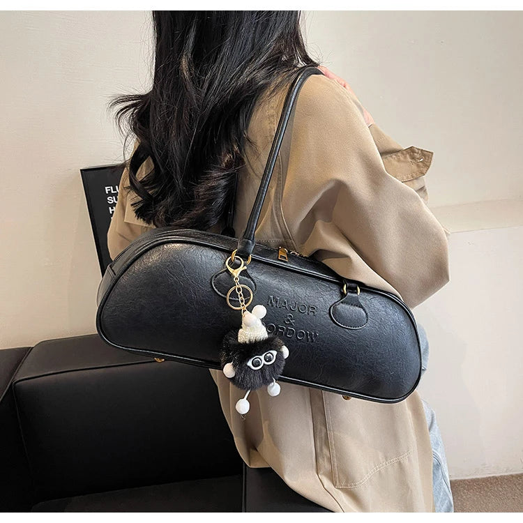 Stitched Pillow-Shape Shoulder Bag 
Trendy zippered handbag with a soft, structured design. Versatile for shoulder or hand carry perfect for everyday style.
