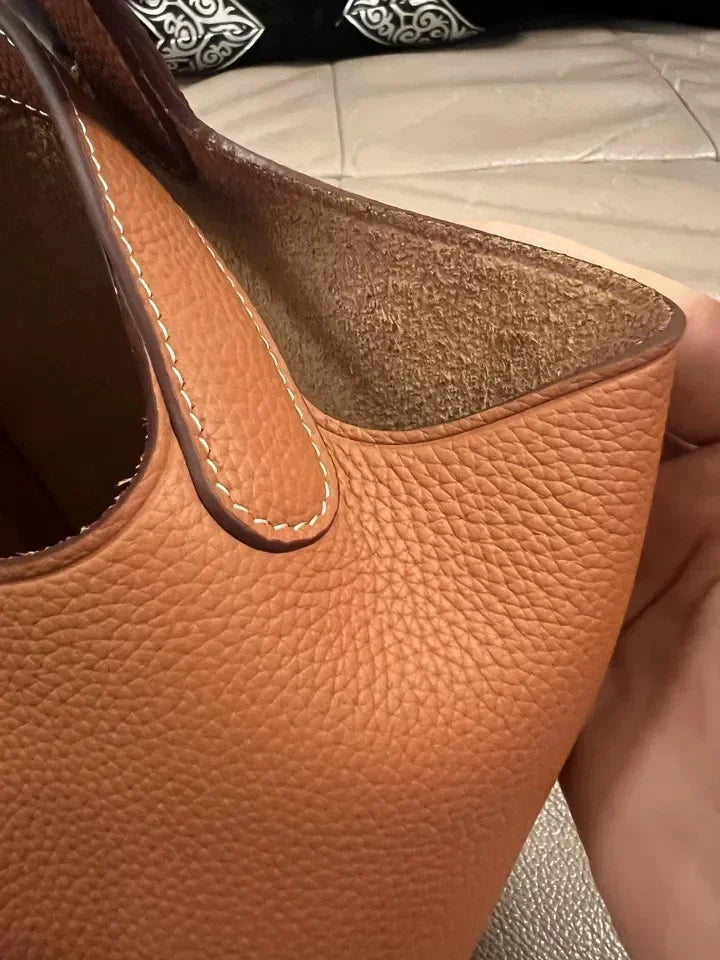 Women’s Leather Bucket Handbag A soft, stylish summer essential featuring a modern basket design with a convenient mobile phone pocket.