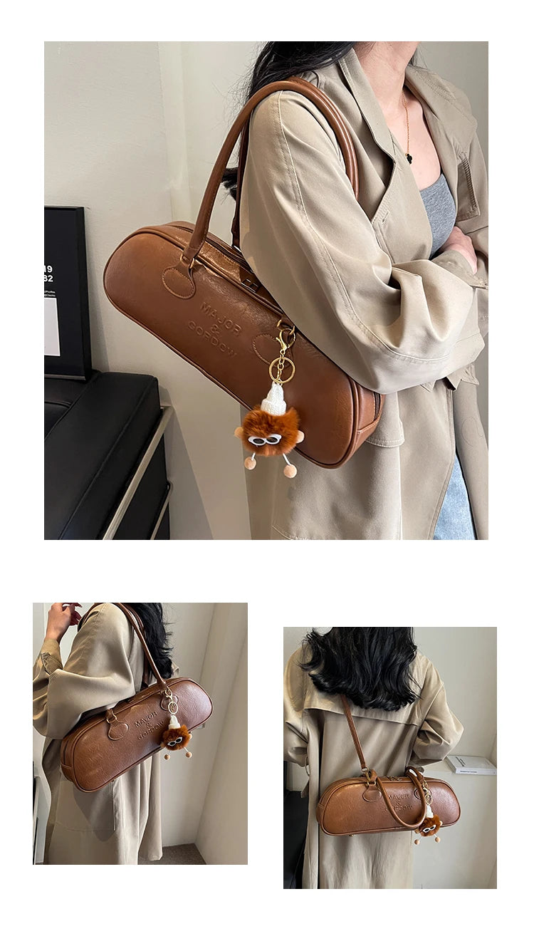 Stitched Pillow-Shape Shoulder Bag 
Trendy zippered handbag with a soft, structured design. Versatile for shoulder or hand carry perfect for everyday style.