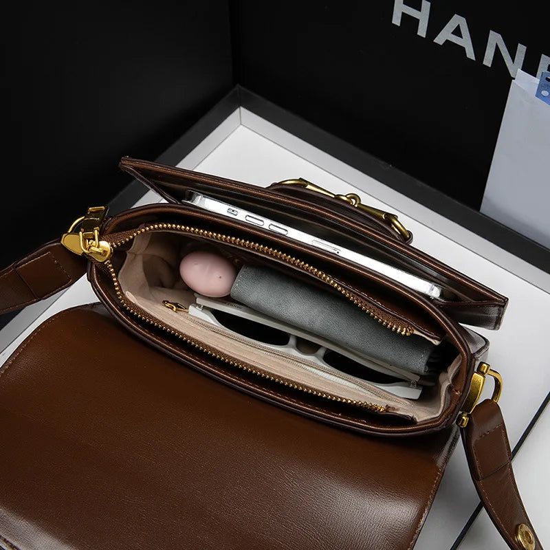Ladies Genuine Leather Saddle Bag Versatile Crossbody Trendy underarm and single-shoulder design with a sleek, modern look. Compact, stylish, and perfect for everyday fashion.
