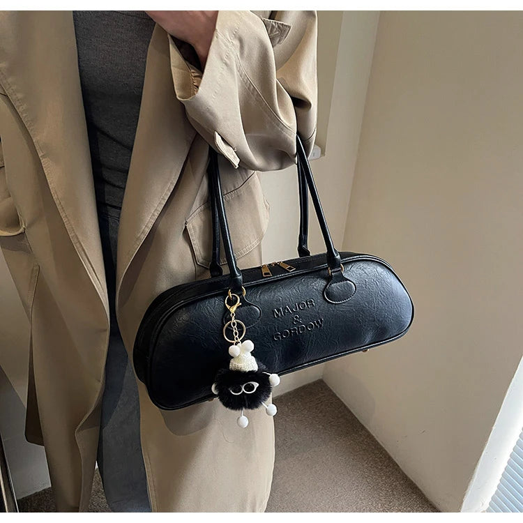 Stitched Pillow-Shape Shoulder Bag 
Trendy zippered handbag with a soft, structured design. Versatile for shoulder or hand carry perfect for everyday style.