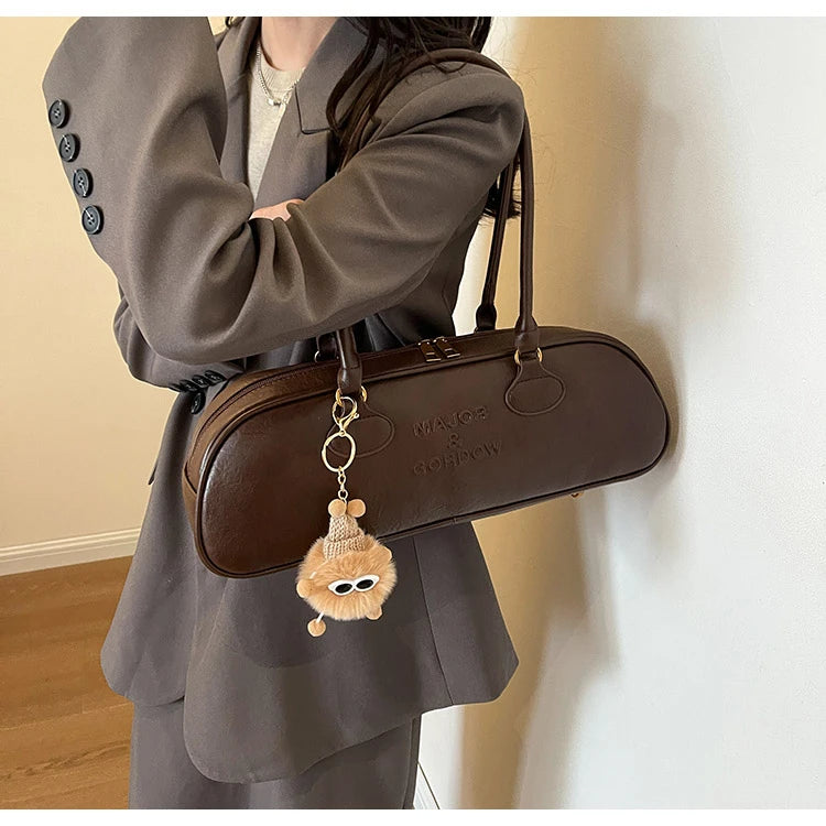 Stitched Pillow-Shape Shoulder Bag 
Trendy zippered handbag with a soft, structured design. Versatile for shoulder or hand carry perfect for everyday style.