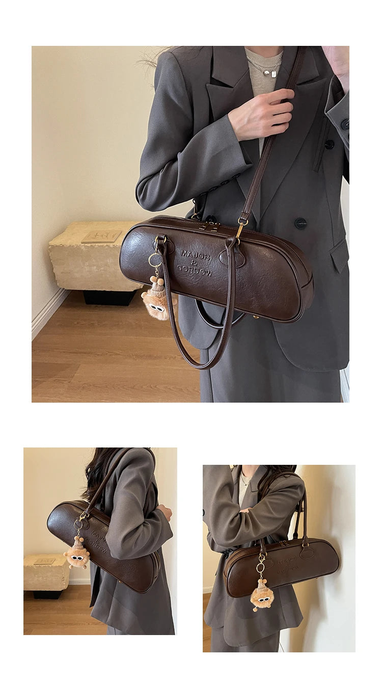 Stitched Pillow-Shape Shoulder Bag 
Trendy zippered handbag with a soft, structured design. Versatile for shoulder or hand carry perfect for everyday style.