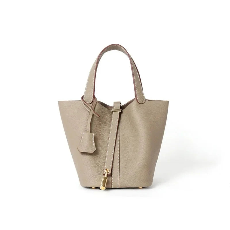 Women’s Leather Bucket Handbag A soft, stylish summer essential featuring a modern basket design with a convenient mobile phone pocket.