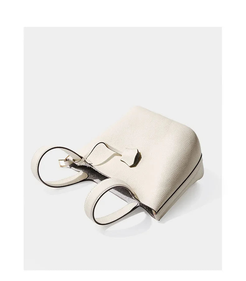 Women’s Leather Bucket Handbag A soft, stylish summer essential featuring a modern basket design with a convenient mobile phone pocket.
