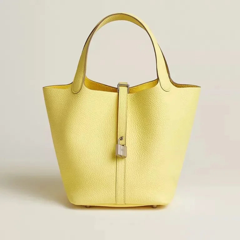 Women’s Leather Bucket Handbag A soft, stylish summer essential featuring a modern basket design with a convenient mobile phone pocket.