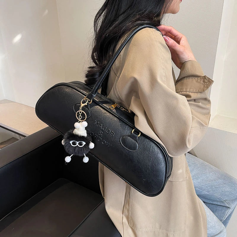 Stitched Pillow-Shape Shoulder Bag 
Trendy zippered handbag with a soft, structured design. Versatile for shoulder or hand carry perfect for everyday style.