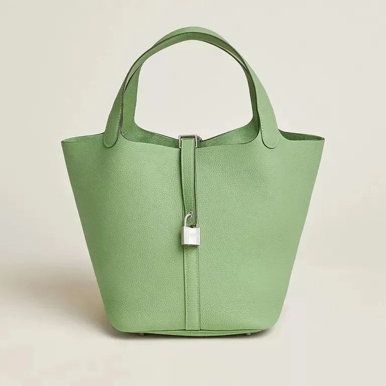 Women’s Leather Bucket Handbag A soft, stylish summer essential featuring a modern basket design with a convenient mobile phone pocket.
