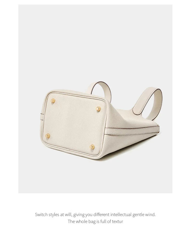Women’s Leather Bucket Handbag A soft, stylish summer essential featuring a modern basket design with a convenient mobile phone pocket.