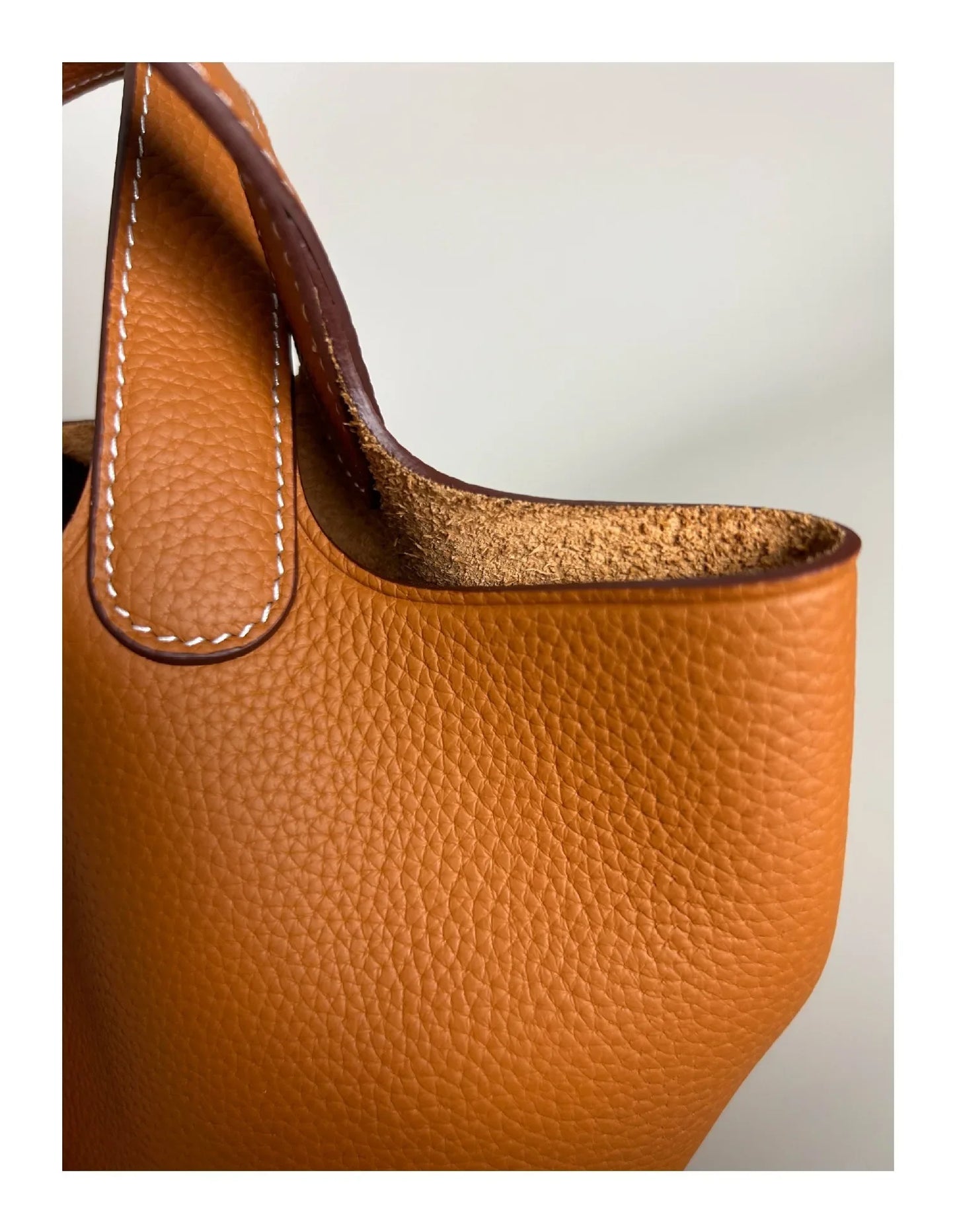 Women’s Leather Bucket Handbag A soft, stylish summer essential featuring a modern basket design with a convenient mobile phone pocket.