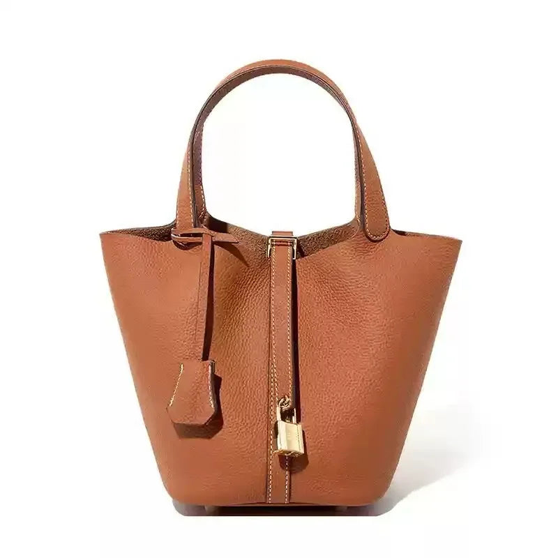 Women’s Leather Bucket Handbag A soft, stylish summer essential featuring a modern basket design with a convenient mobile phone pocket.